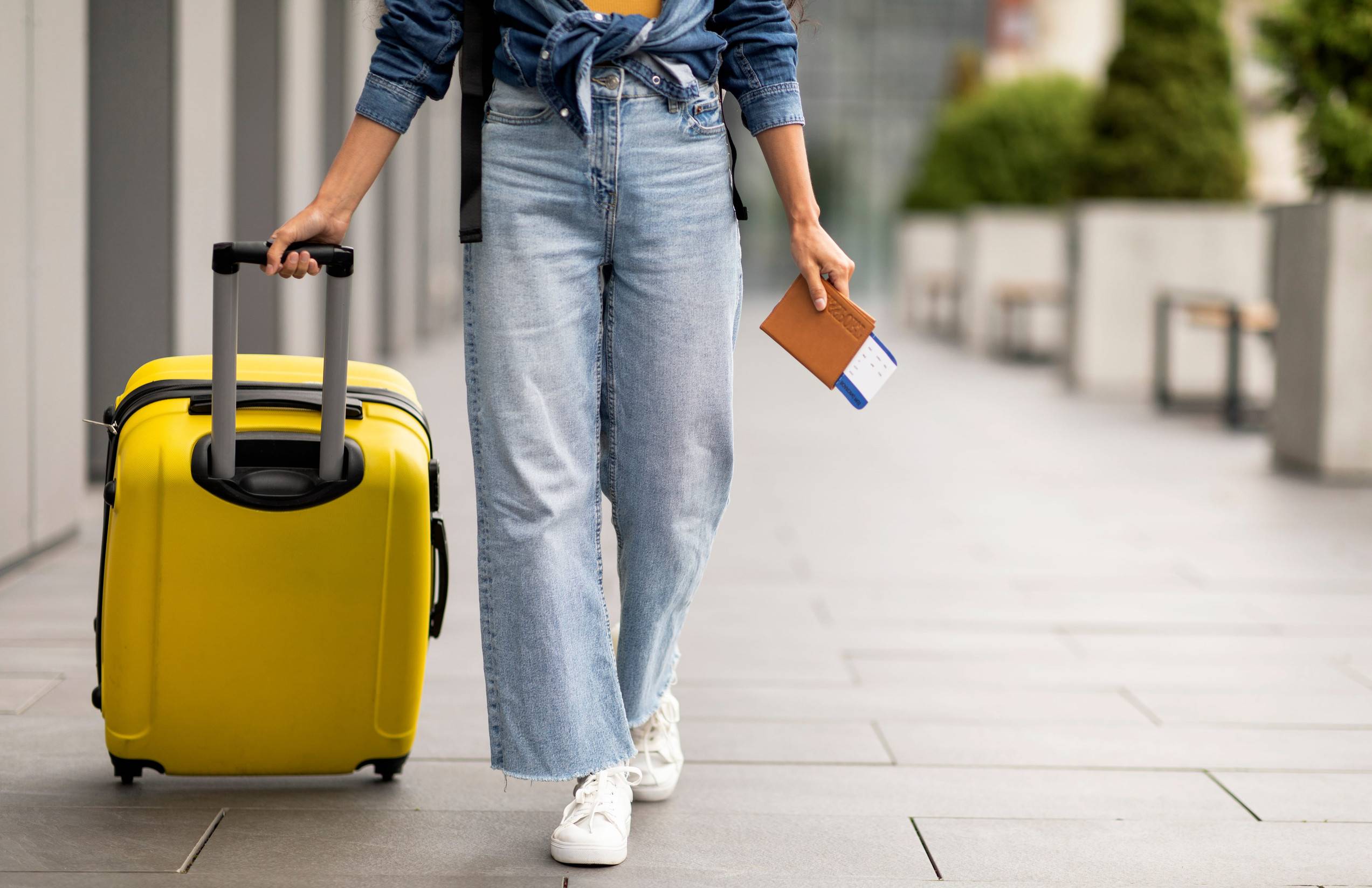 Female Travellers Carrying A Suitcase And Passport