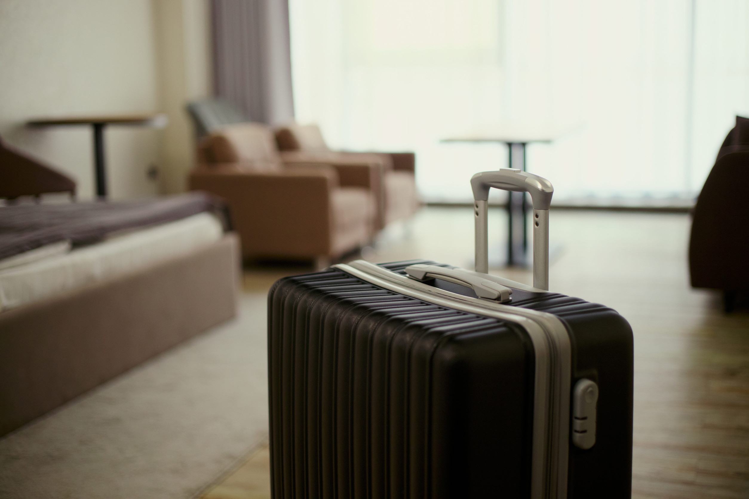 Suitcase in a lone hotel room