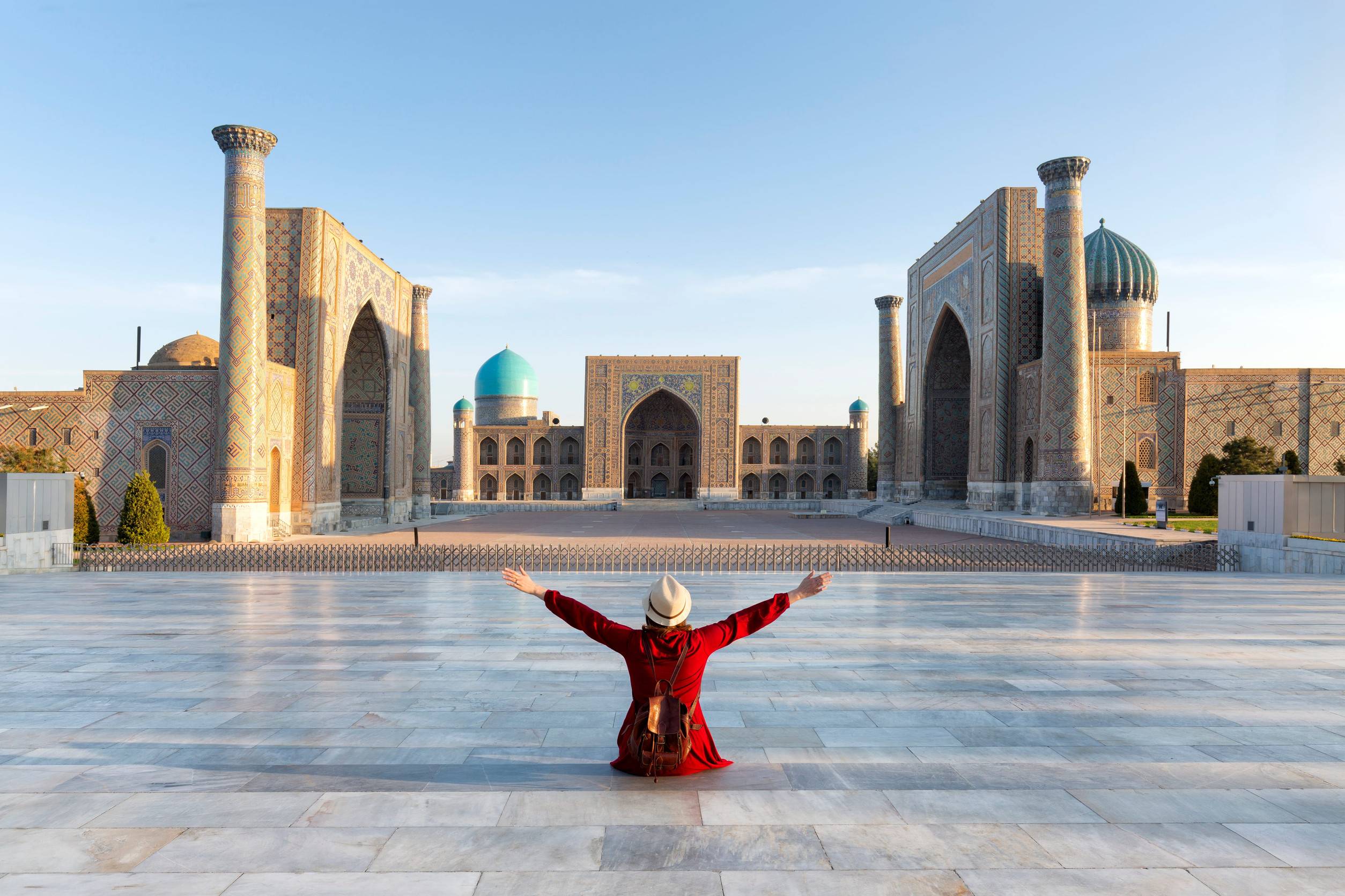 Tourist experiencing Registan Square in Uzbekistan